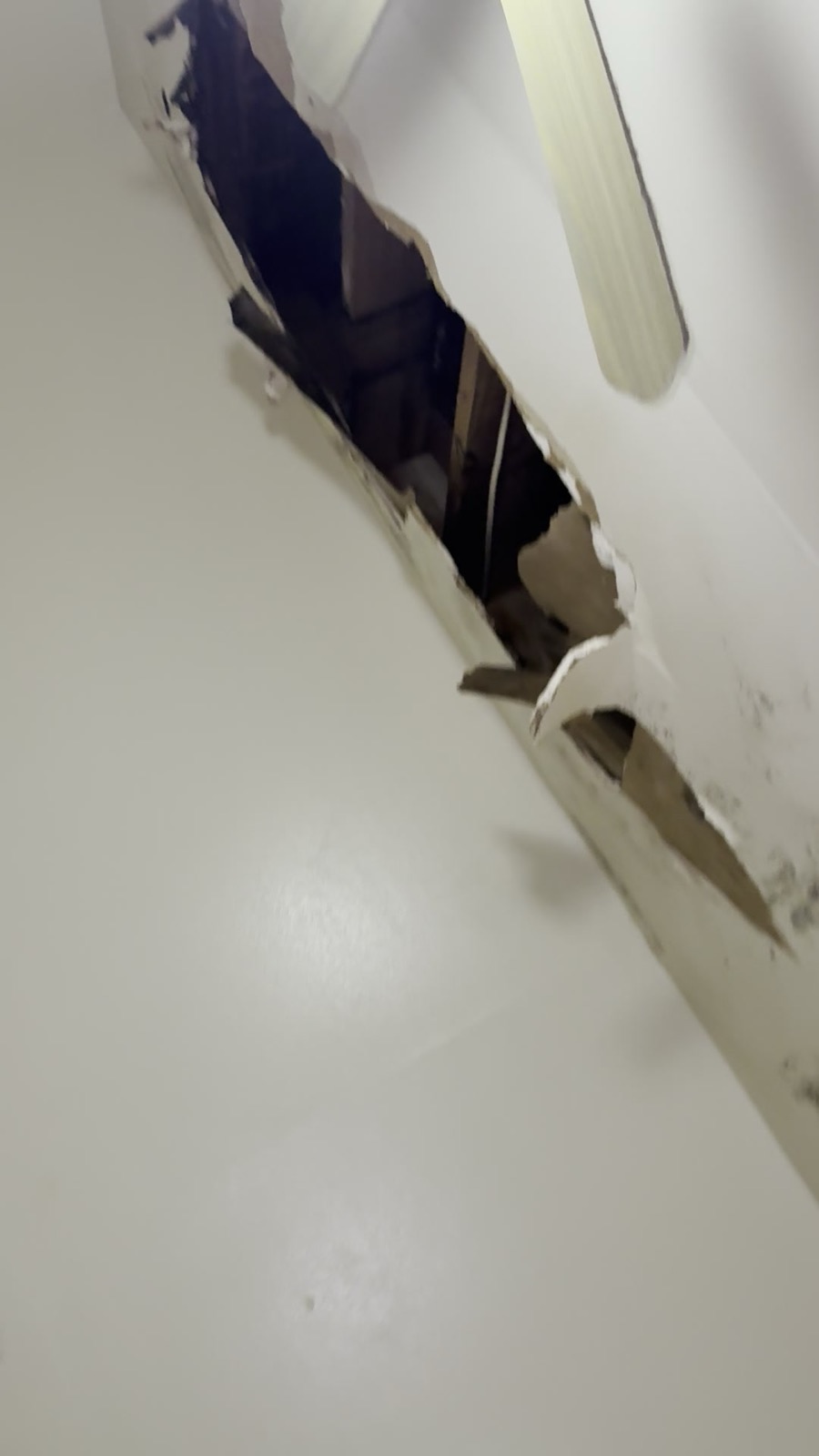 Photo 1 for issue: Inside the abandoned Unit 506 above: collapsed ceiling & rotted, moldy roof